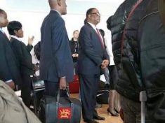 Peter Mutharika queues for plane