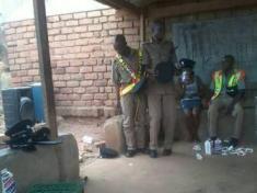 Malawi Police officers drinking beer