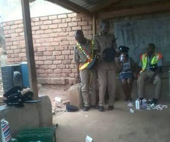 Malawi Police officers drinking beer