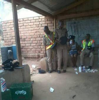Malawi Police officers drinking beer