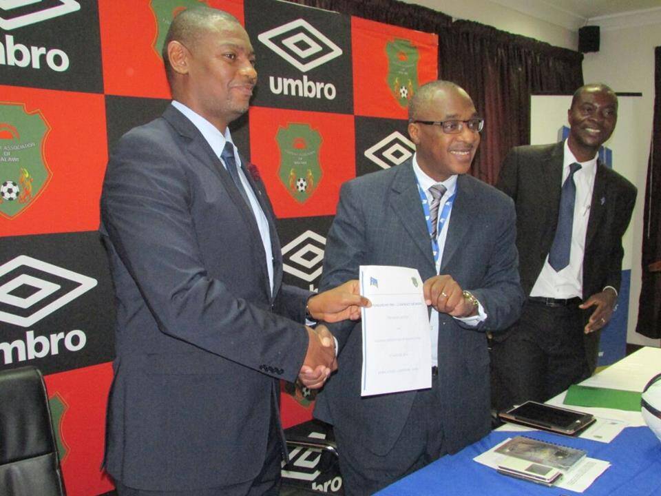 FAM's Walter Nyamilandu shows the contract together with FDH's