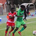 Malawi and Kenya national football teams playing against each other.