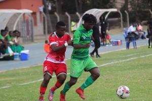 Malawi and Kenya national football teams playing against each other.