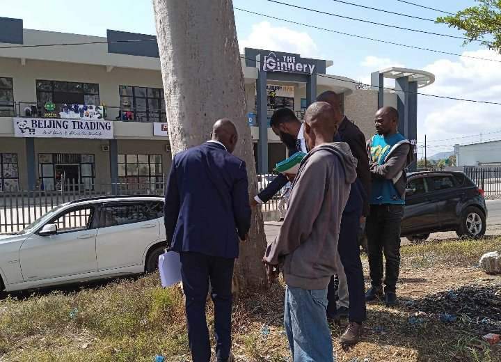 Clifford Khomba with a Magistrate and lawyers at the scene of the incident