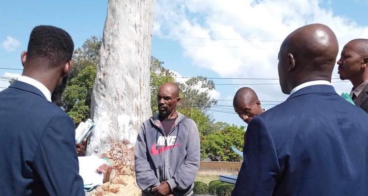 Clifford Khomba accused of hitting police officer
