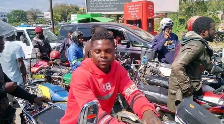 Motorists and motorcyclists queue for fuel in Malawi