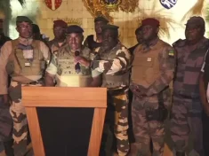 Image of soldiers announcing the coup in Gabon that President Bongo has been ousted and put on house arrest.