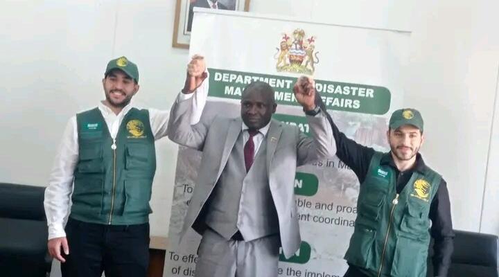 Commissioner for Disaster Management Affairs, Charles Kalemba with representatives of King Salman Relief Centre of Saudi Arabia.