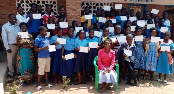 Stella Phiri pose with PSLCE graduates