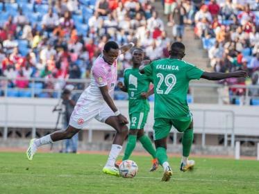 A Nyasa Big Bullets and a Mafco fight for the ball in the FDH Cup final