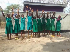 Girls celebrating construction of changing rooms in Balaka