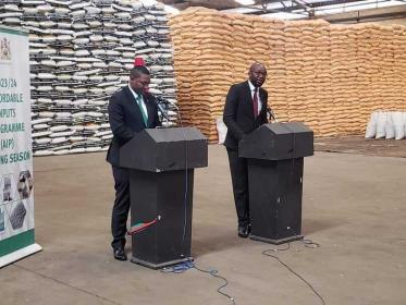 Minister of Agriculture Sam Kawale and Minister of Information Moses Kunkuyu speaking at a press briefing in Lilongwe