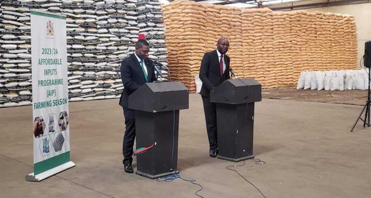 Minister of Agriculture Sam Kawale and Minister of Information Moses Kunkuyu speaking at a press briefing in Lilongwe