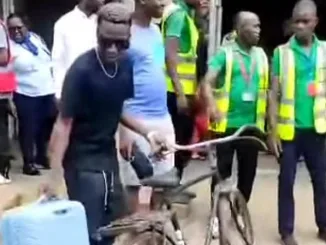 Black Nina at an airport in Malawi where he wanted to carry his bicycle into a plane