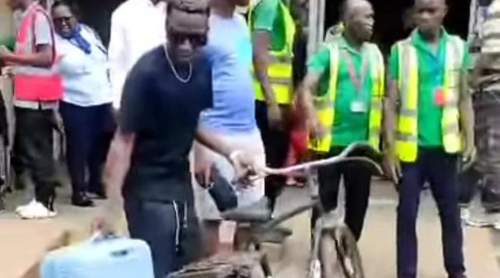 Black Nina at an airport in Malawi where he wanted to carry his bicycle into a plane