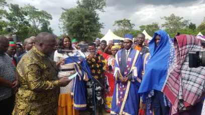 Minister of Local Government Richard Chimwendo Banda (L) elevating chiefs