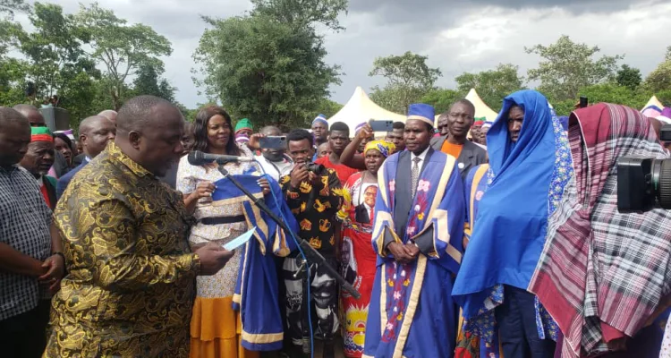 Minister of Local Government Richard Chimwendo Banda (L) elevating chiefs