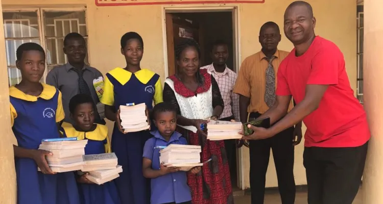 An organisation called Harmony for Families and Communities has donated notebooks and pens to needy learners at Sakata Primary School, Traditional Authority Nkagula in Zomba.