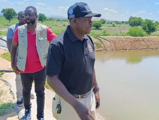 Charles Kalemba and other DODMA officials at an irrigation scheme at Tengani in Nsanje