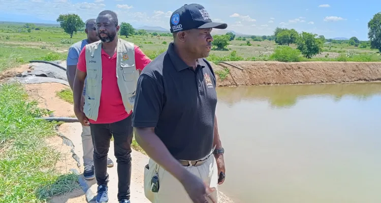 Charles Kalemba and other DODMA officials at an irrigation scheme at Tengani in Nsanje