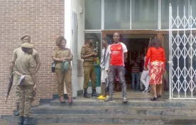 A herbalist (in red jersey) after being sentenced