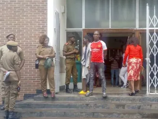 A herbalist (in red jersey) after being sentenced