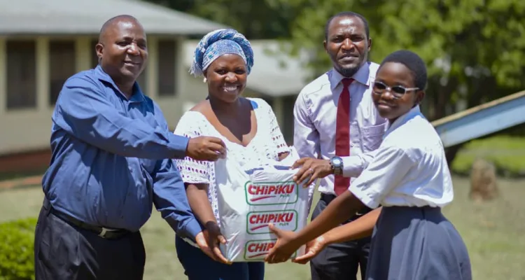 Age Africa donates assorted items to bursary beneficiaries at Masongola Secondary School