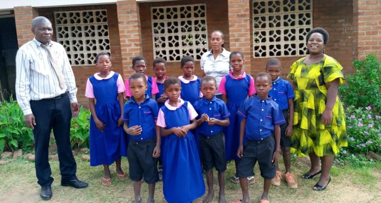 A teacher at Mulunguzi Primary School in Zomba, Mukire Rachel Mhango, has donated school uniform to 20 needy students to encourage them to remain in school to concentrate on their education.