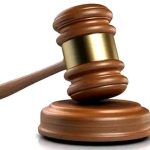 Gavel and sound block symbolising judicial authority and legal processes.