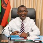 An official in Malawi's government office during district council transfers to fight corruption.