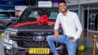 Malawi celebrity barber Prince Butani, known as Barber 1, posing with his newly purchased Ford Ranger bearing the customised number plate 1Barber, bought from CFAO Malawi for a reported K200 million in April 2026