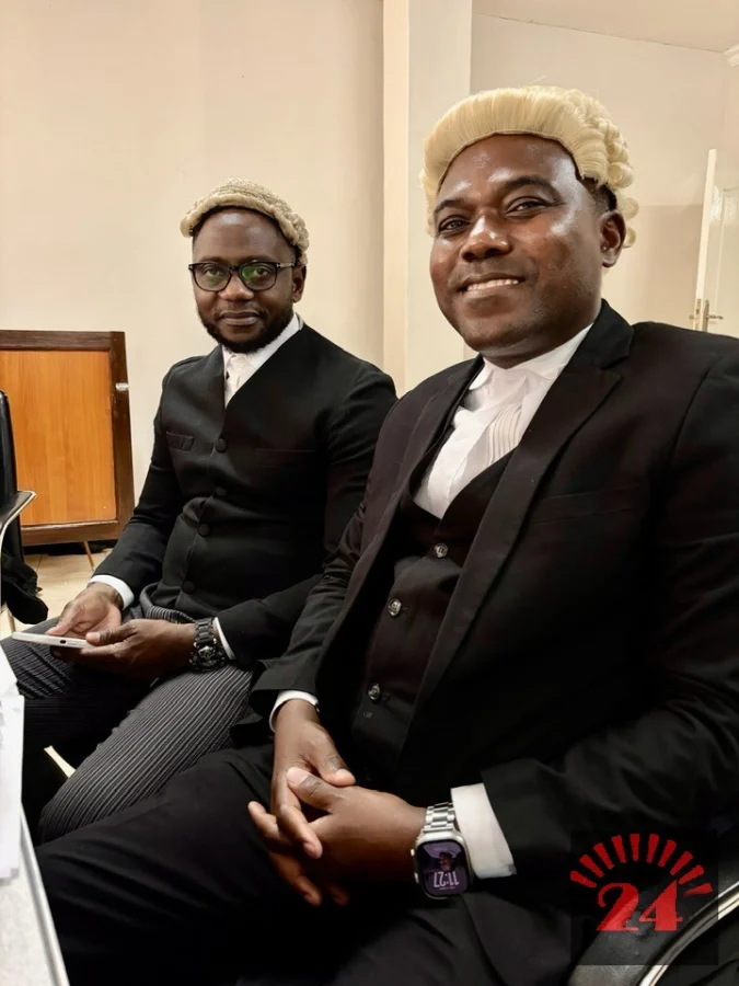 Malawi lawyer Wapona Kita with the Attorney General during a public event amid the Finance Bank compensation case