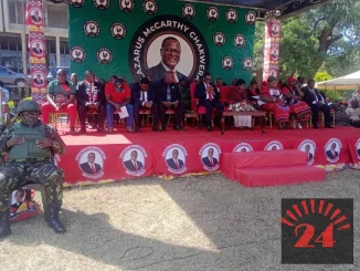 MCP supporters at the Kamuzu Day parallel rally in Lilongwe Malawi on May 14 2026 in front of a podium decorated with Lazarus Chakwera's face rather than Kamuzu Banda's with all attendants wearing Chakwera party attire and no Kamuzu regalia in sight