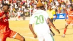 FCB Nyasa Big Bullets and Moyale Barracks players tussle for the ball during a TNM Super League match at Joyce Chitsulo Stadium in Mwanza