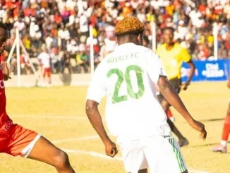 FCB Nyasa Big Bullets and Moyale Barracks players tussle for the ball during a TNM Super League match at Joyce Chitsulo Stadium in Mwanza
