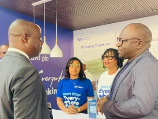 Chapo Left Engaging With Nbm Plc Representative Eric Bob Munthali During The Maputo International Trade Fairfacim 002- Malawi24