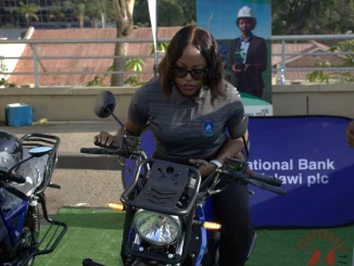 Nbm Plc Relationship Manager Rachel Chirambo Testing The E Bike 002- Malawi24